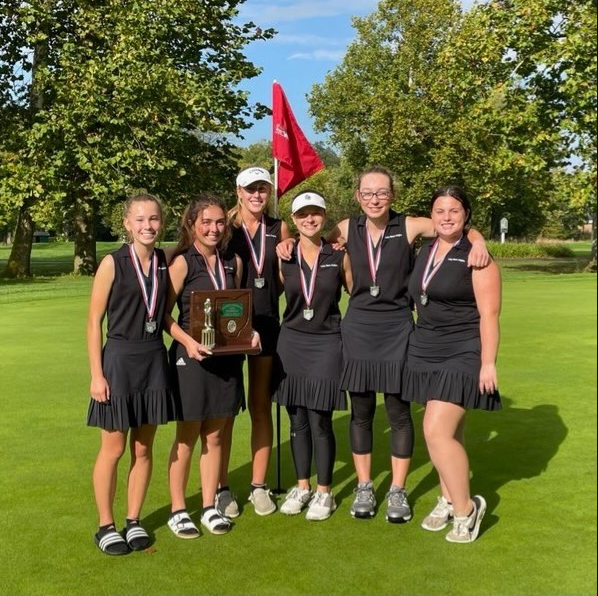 Girls Golf Team at District Tournament with Trophy